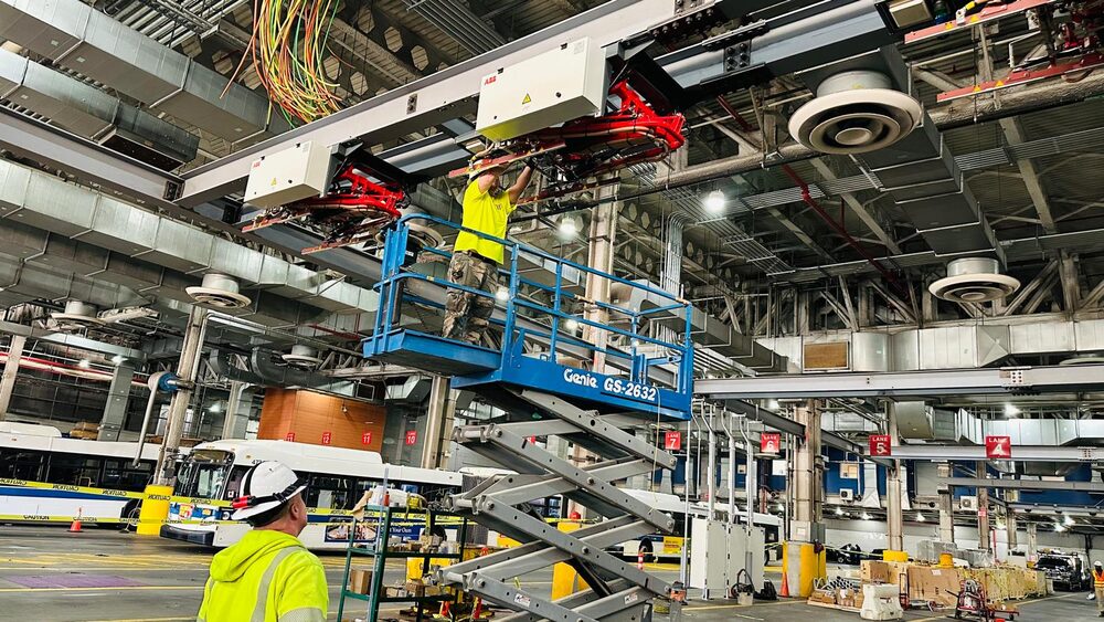Overhead Charger, Crew Installing